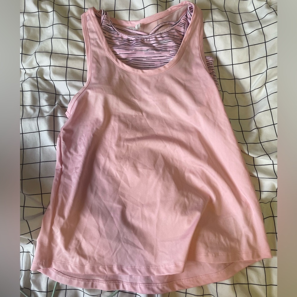 Pink athletic tank top with sports bra attached